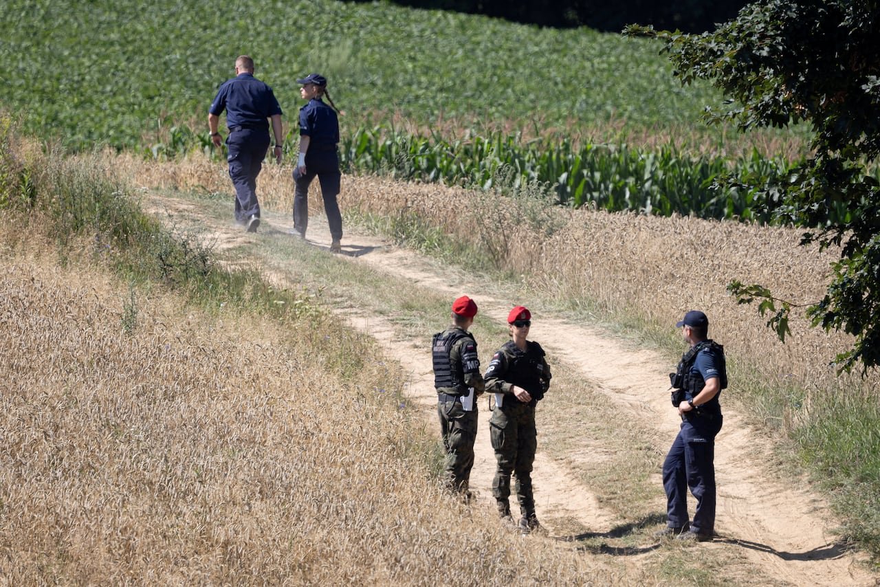 Officials in a field.